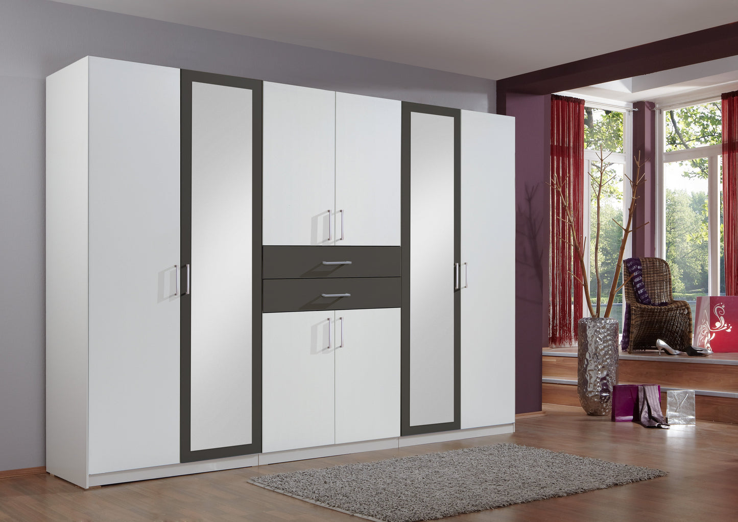 White wardrobe with black accents in a room with a window and chair.