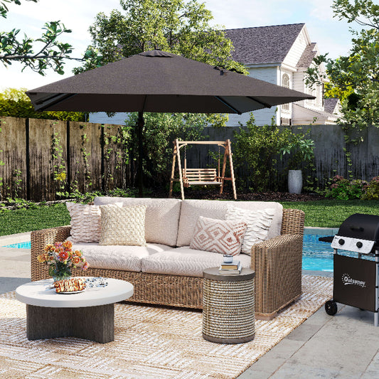 Outdoor patio set with sofa, table, and umbrella on a patio with pool and backyard.