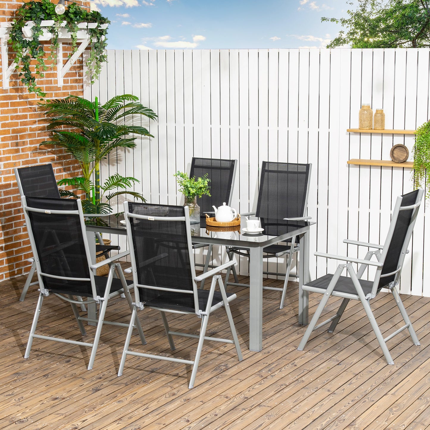 طقم طعام للحديقة من Outsunny مكون من 7 قطع، طاولة خارجية و6 كراسي قابلة للطي والإمالة، إطار من الألومنيوم، طاولة ذات سطح زجاجي مقسّى، مقاعد Texteline، أسود