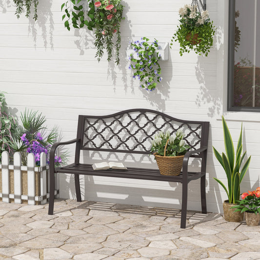 Decorative outdoor bench with plants on a stone patio