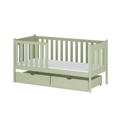 Light green crib with a white mattress on a white background