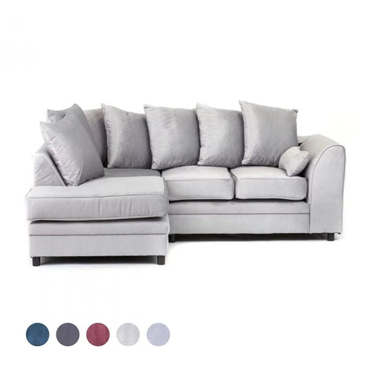 A light grey velvet corner sofa with multiple cushions, showcasing its design and color against a white background with a label at the bottom corner.