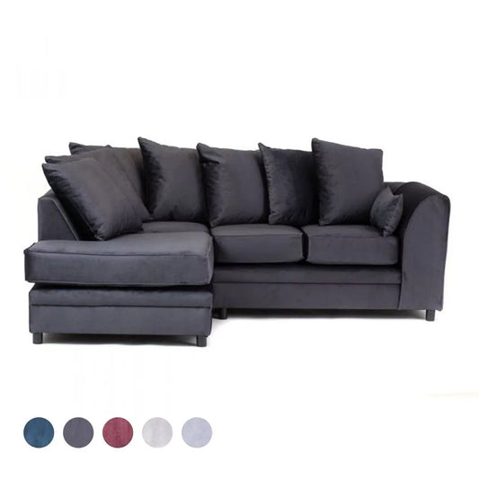 A dark grey velvet corner sofa with foam cushions and a wood and plastic frame.