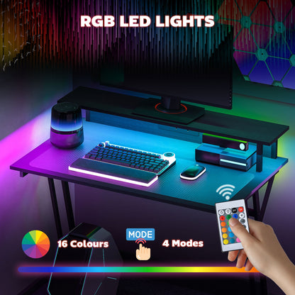 Biurko gamingowe HOMCOM z oświetleniem LED i gniazdami zasilania, 100 x 60 cm, biurko komputerowe w kształcie litery Z z podstawą pod monitor i stalową ramą, stół do gier na PC do domowego biura, czarny