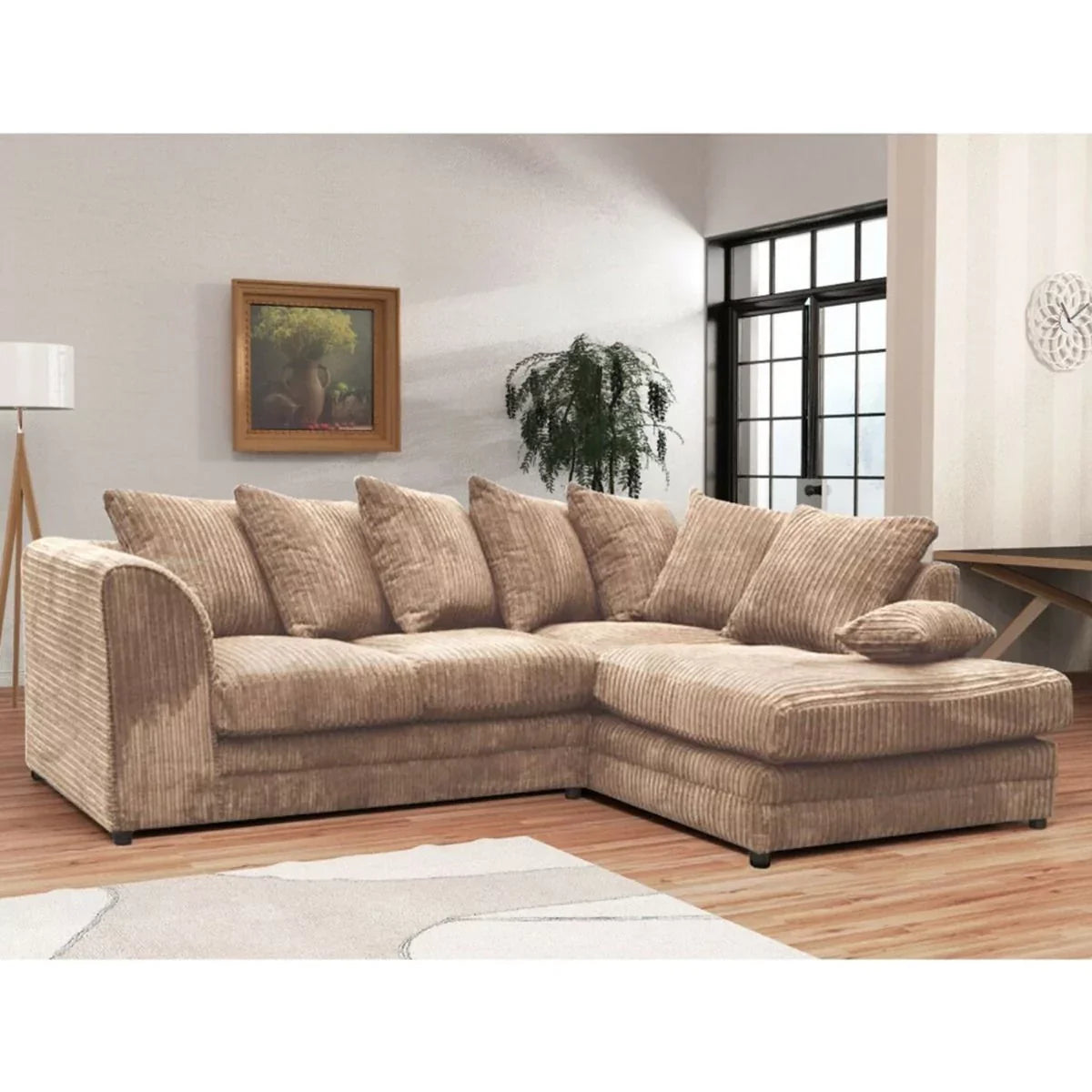 A corner sofa suite with a mink color fabric, featuring a right-angled corner design, multiple cushions, and a wooden frame.