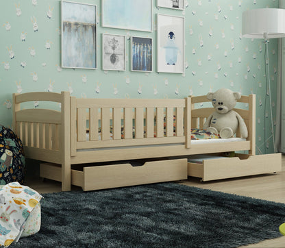 Children's room with a wooden bed, teddy bear, and framed pictures on a light blue wall.